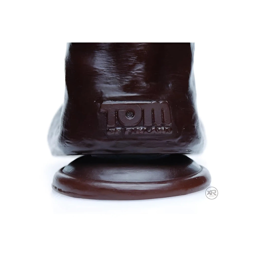 Brown Tom of Finland Break Time realistic dildo with base, featuring embossed brand logo.
