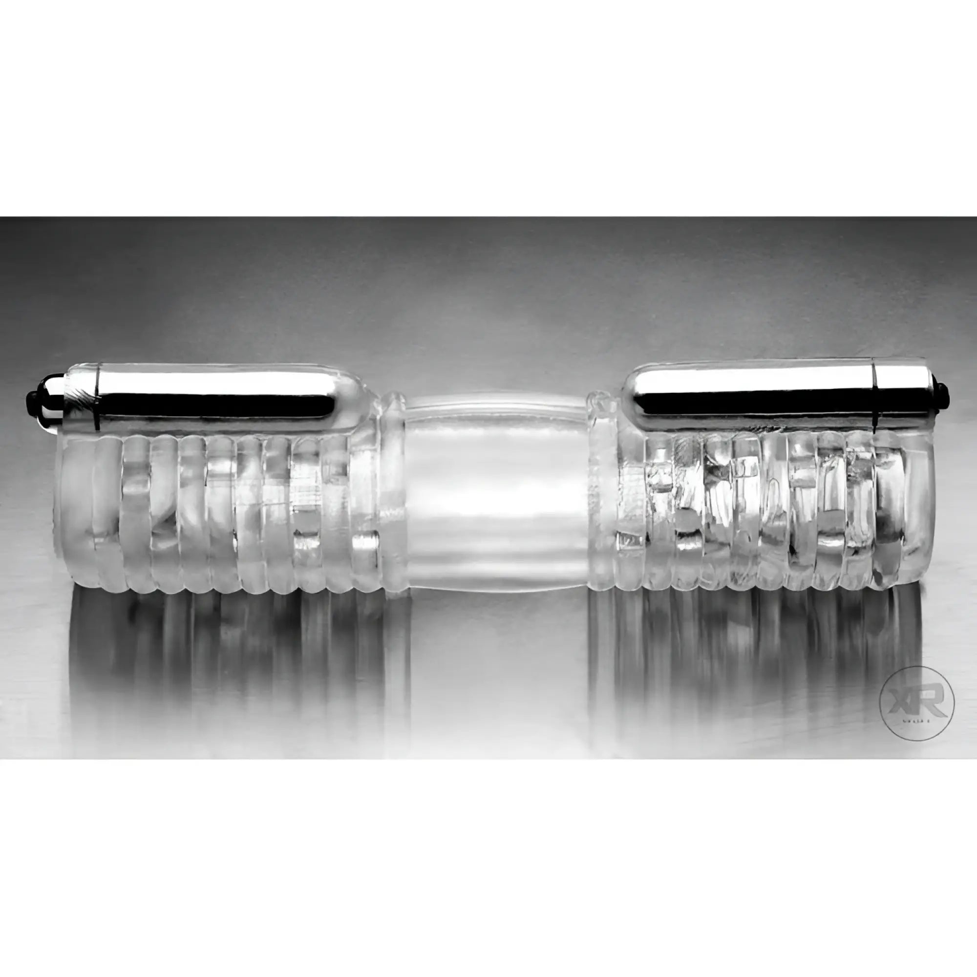 Tom of Finland Head to Head vibrating sleeve: a clear, ribbed silicone sleeve with dual metallic bullet vibrators.