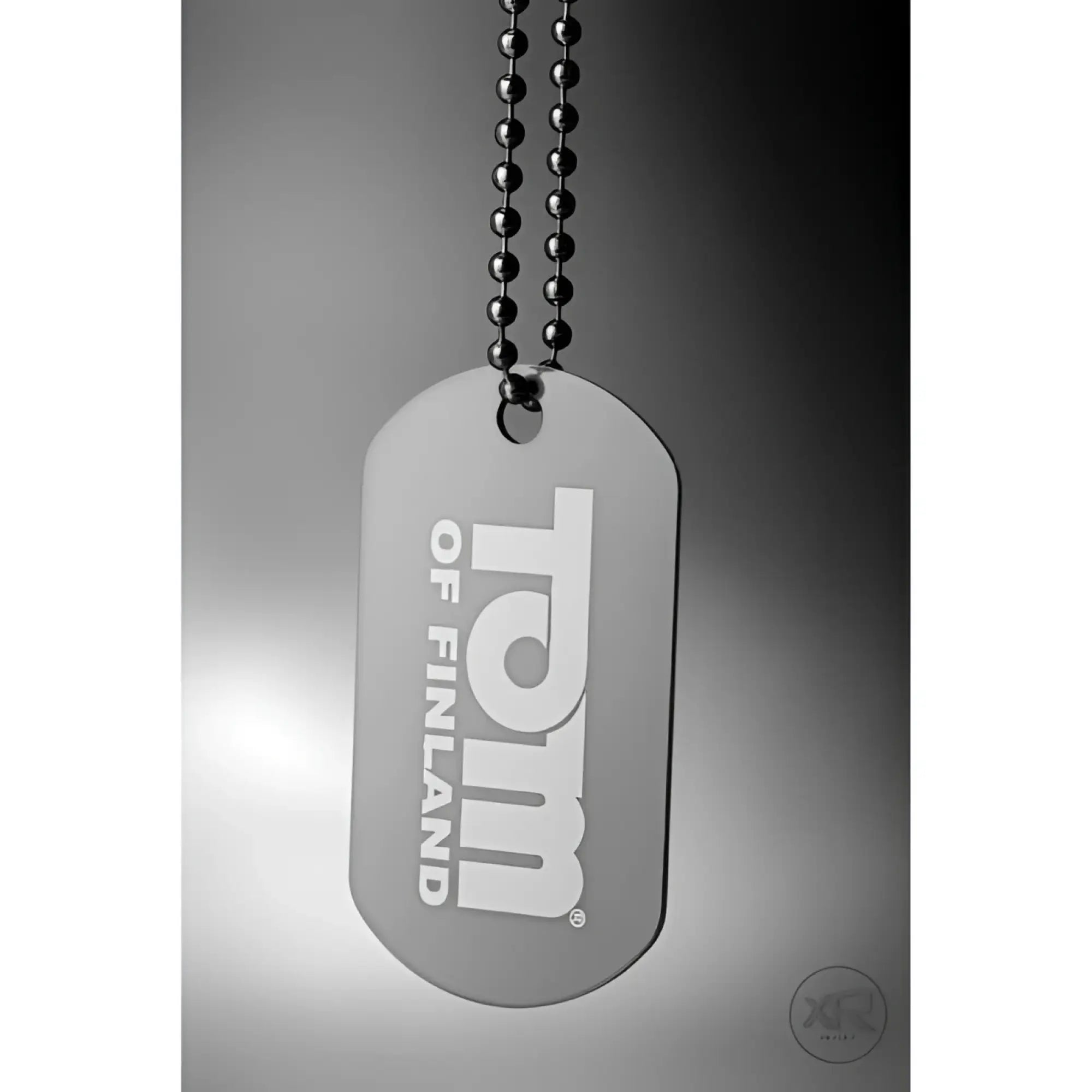 Silver Tom of Finland dog tag pendant on a matching metallic ball chain against a grey gradient background.