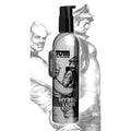 Tom of Finland Hybrid Lube in a silver pump bottle with a dog tag, featuring black-and-white illustrated artwork.