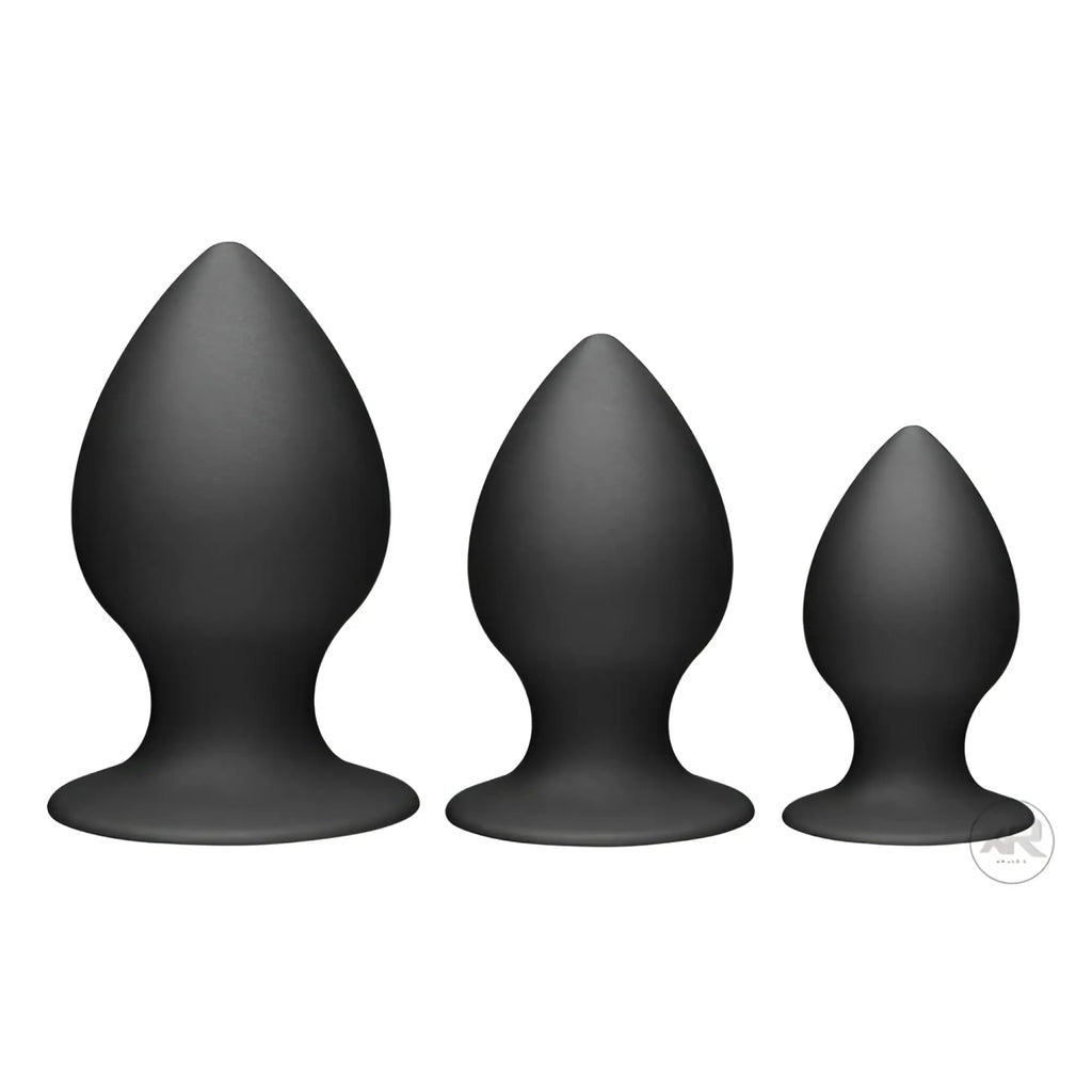 Set of three black silicone butt plugs in varying sizes from largest to smallest tom of finland large anal plug