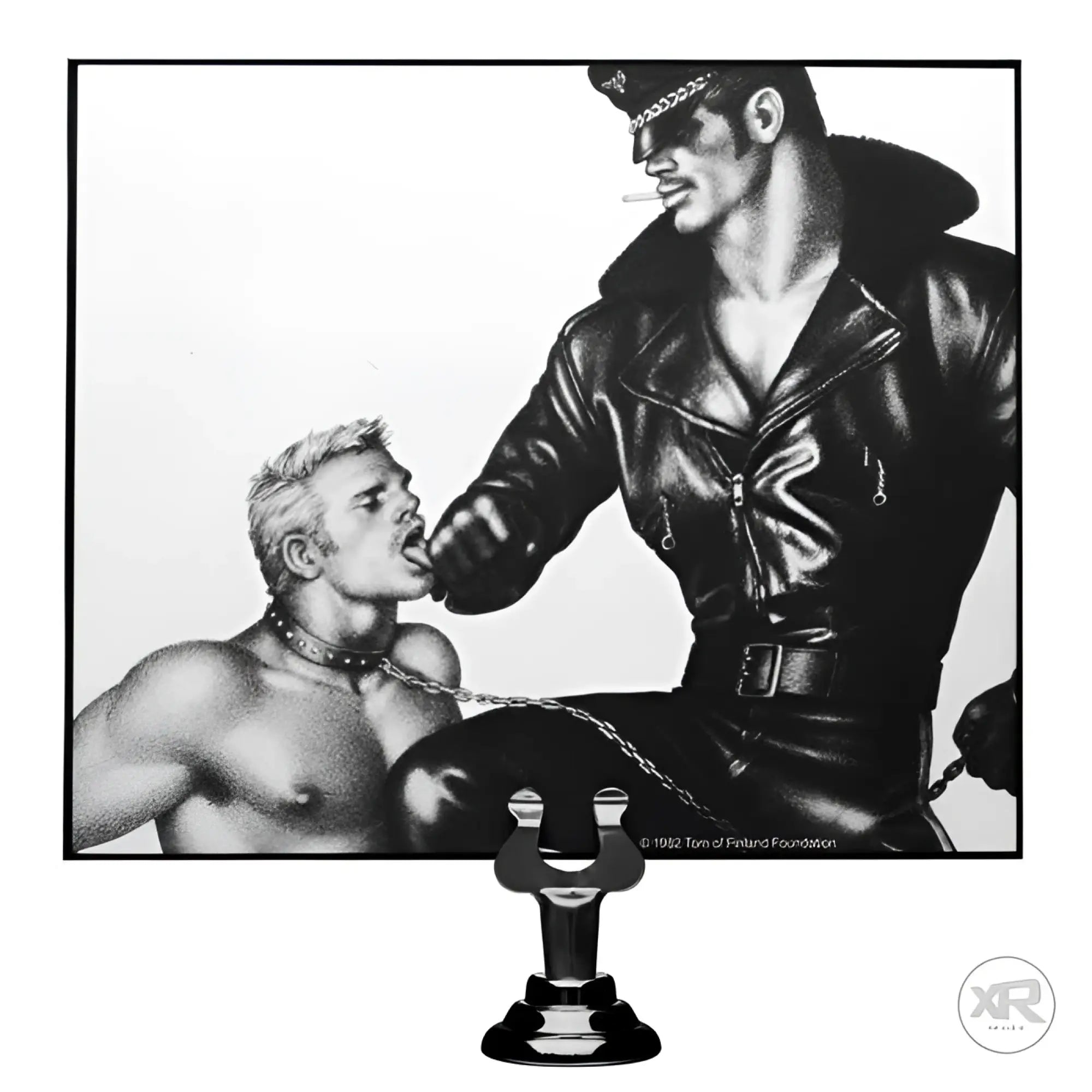 Black and white Tom of Finland Leash print showing a leather-clad man holding a leash connected to a collar.