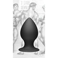 Tom of Finland medium black silicone anal plug with a tapered shape and wide base against a vintage illustration backdrop.