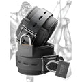 Two black neoprene Tom of Finland wrist cuffs with buckles and matching Tom of Finland branded padlocks.