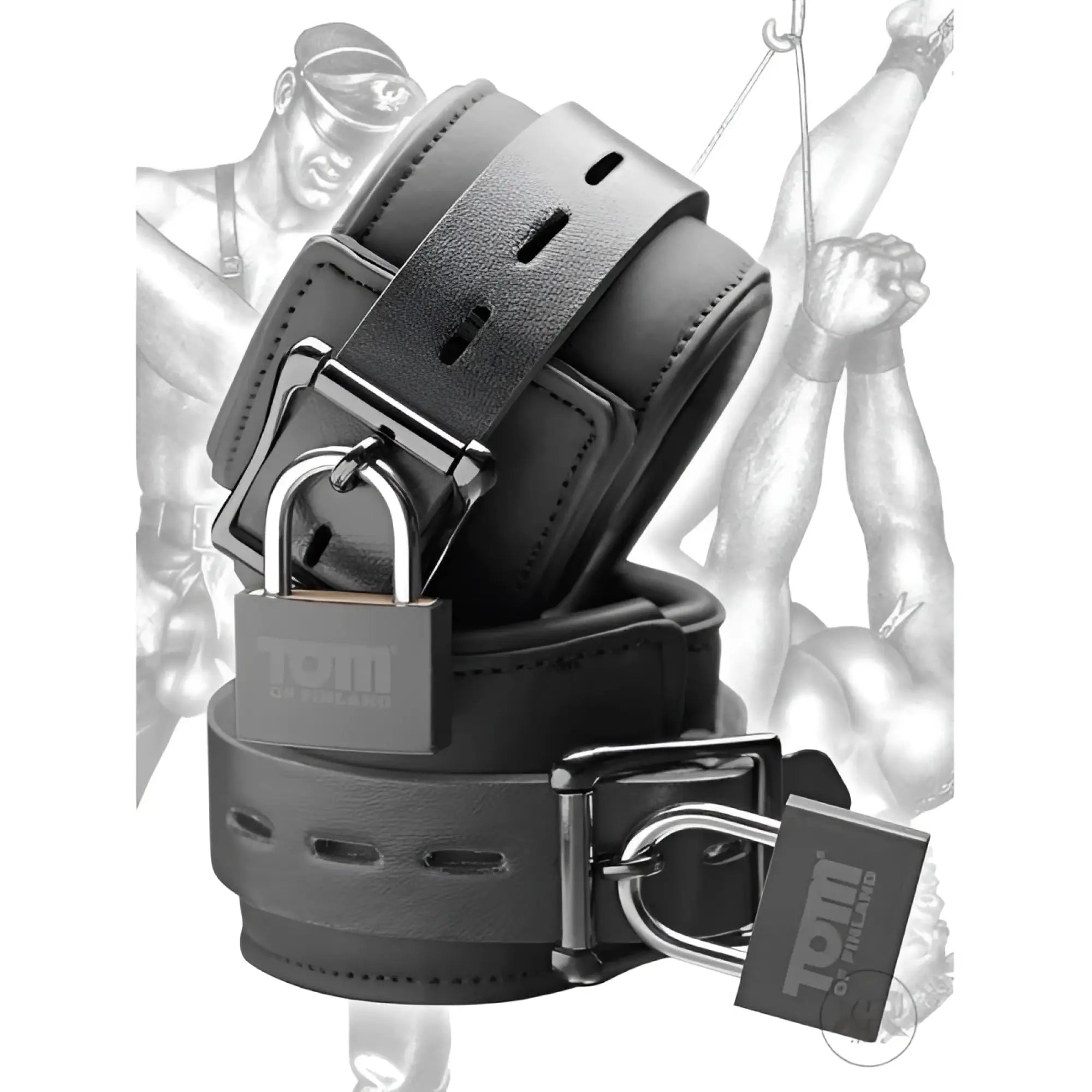 Two black neoprene Tom of Finland wrist cuffs with buckles and matching Tom of Finland branded padlocks.