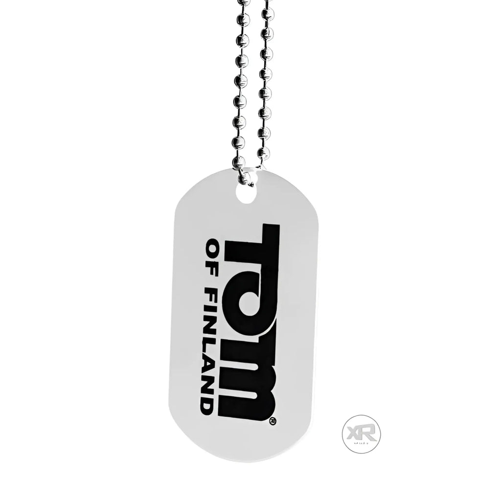 Silver dog tag with black tom of finland logo on surface attached to ball chain for tom of finland seaman lube 8 oz