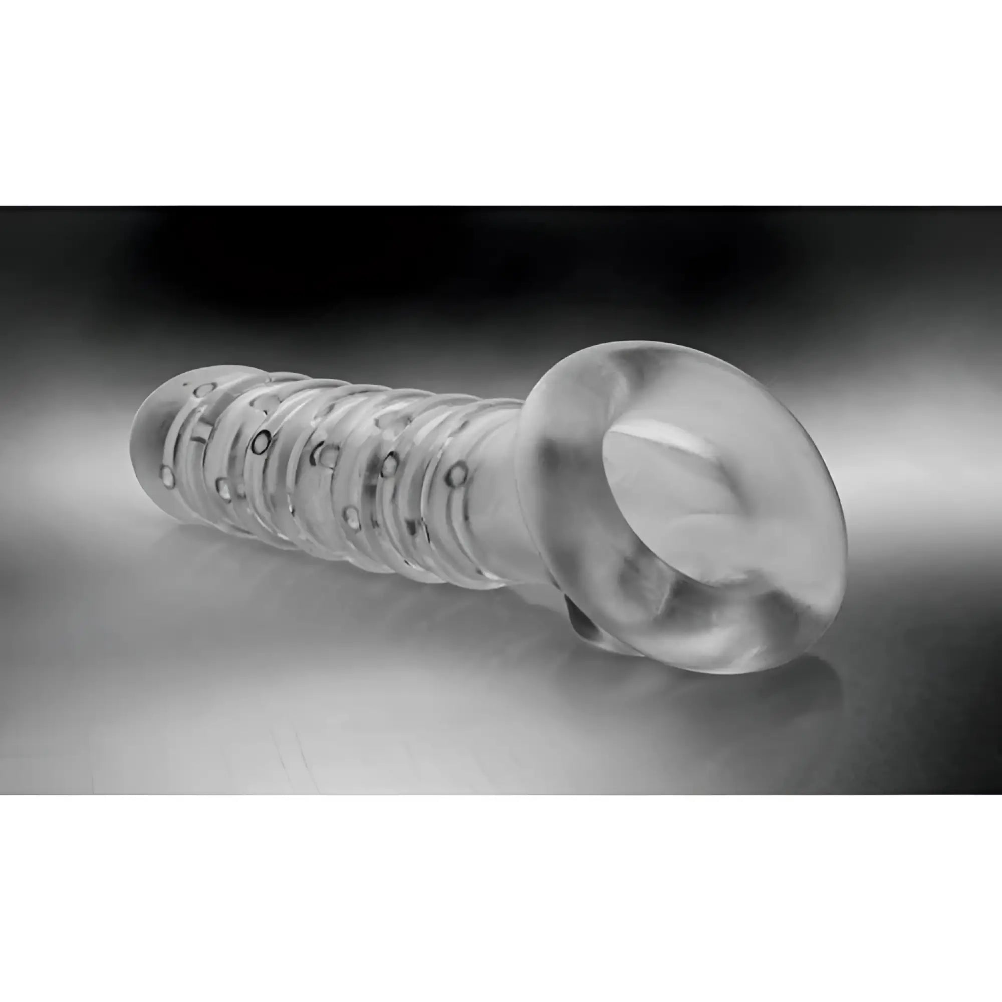 Clear transparent glass dildo with textured segmented body and rounded head from Tom of Finland textured girth enhancer