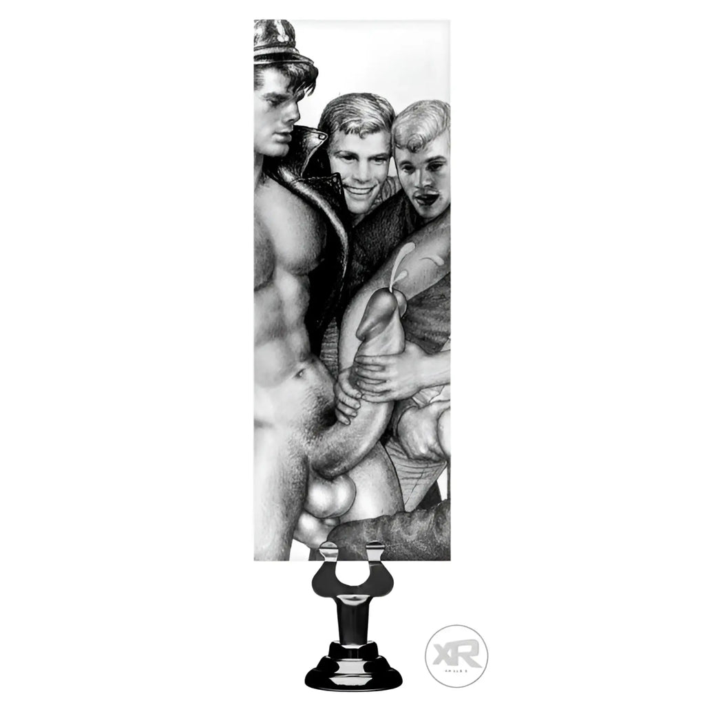 Tom of Finland 12-inch dildo with a black suction cup base, featuring a classic black-and-white Tom of Finland illustration.