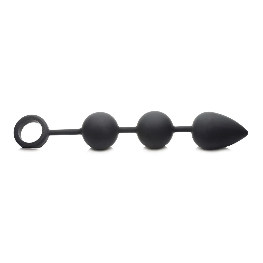 Tom of Finland weighted anal beads in matte black, featuring three rounded beads, a teardrop end, and a pull ring.