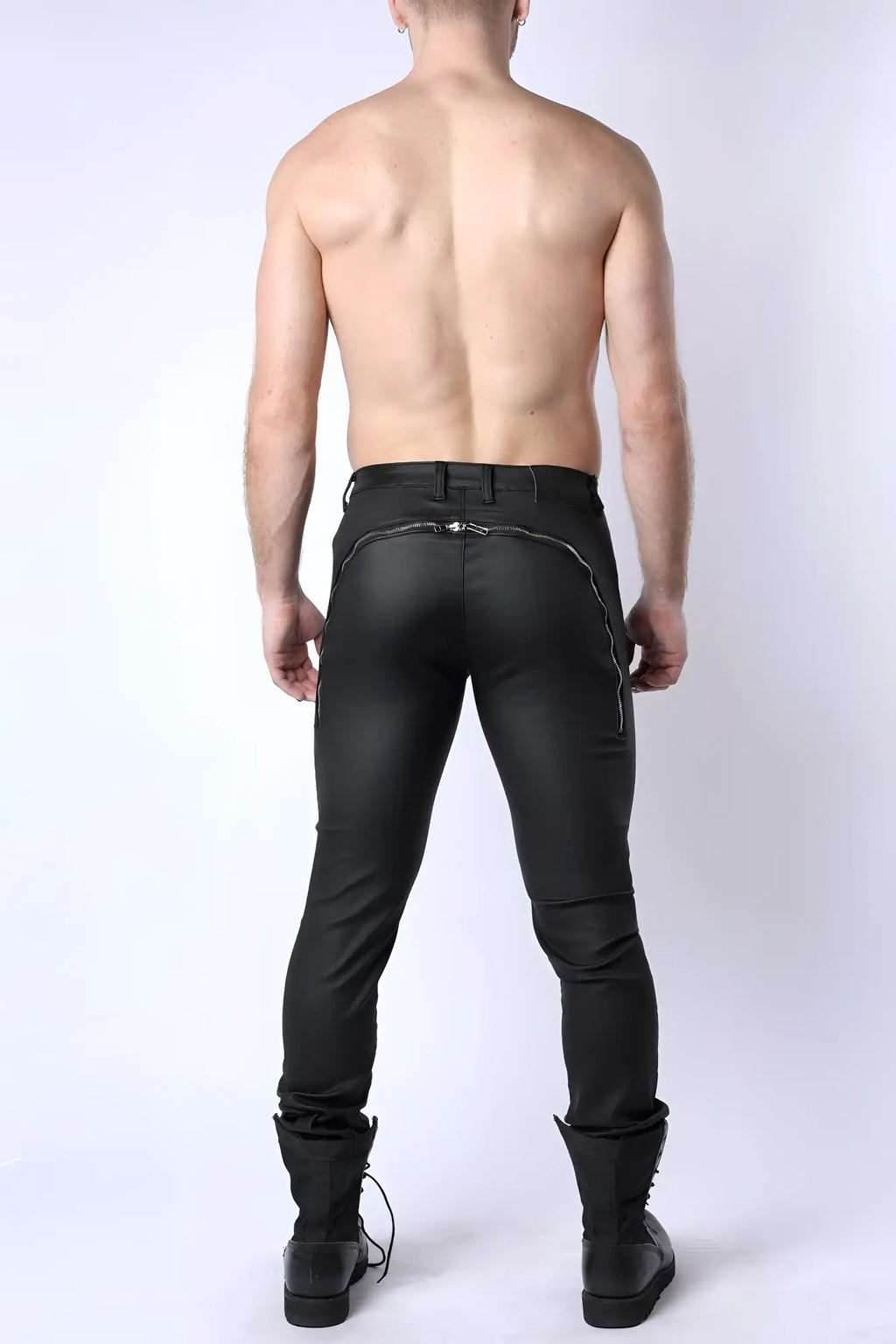Black leather Toro zipper pant shown from the back with sleek form fitting design and silver zipper accents along seam