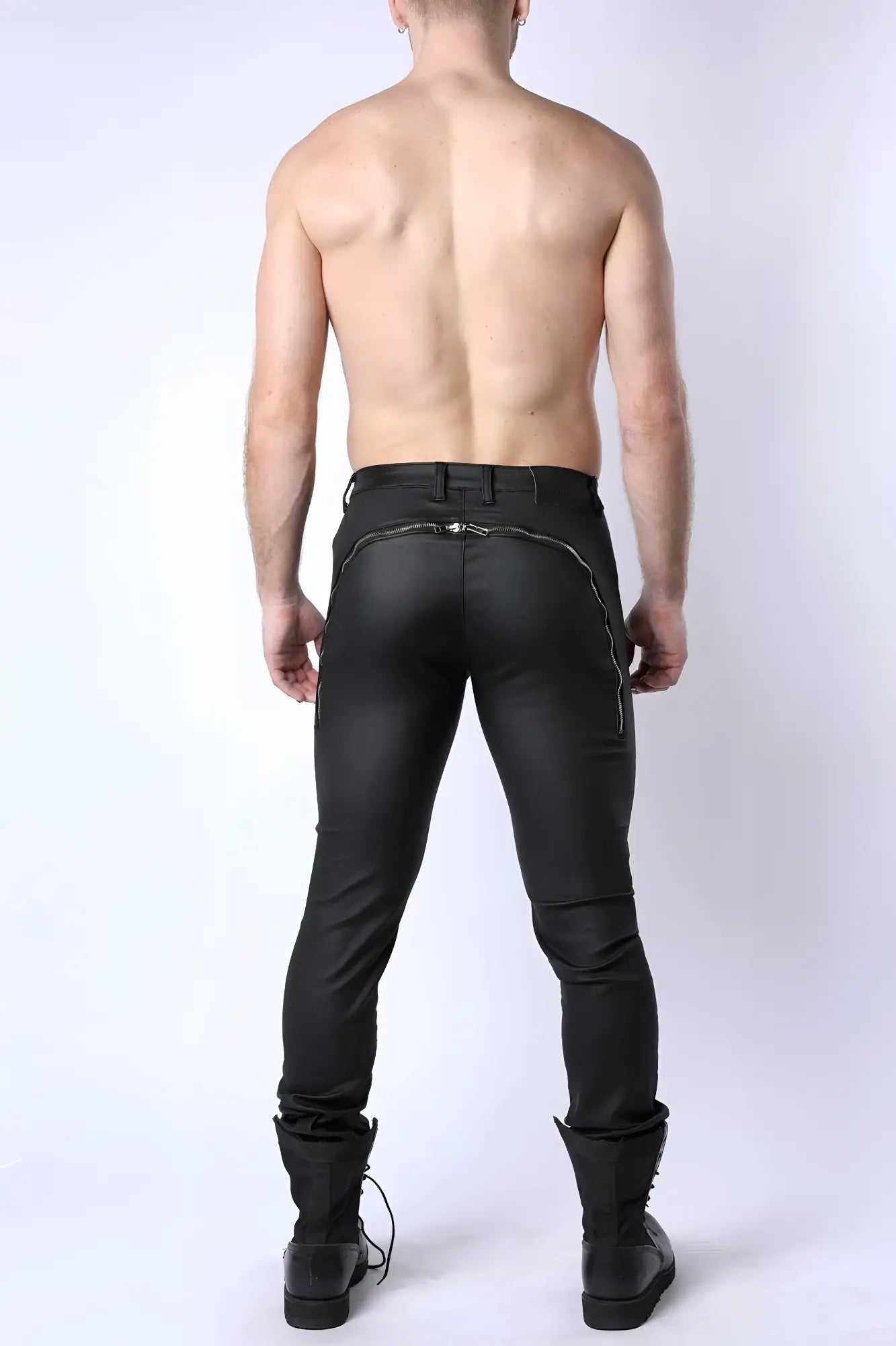 Black leather Toro zipper pant shown from the back with sleek form fitting design and silver zipper accents along seam
