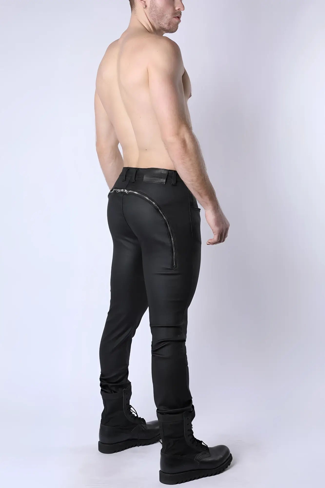 Black leather toro zipper pant showing back side with sleek form-fitting design and silver zipper along the seam