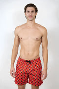 Red toucan print swim short with black and yellow abstract pattern designed for swimming and beachwear