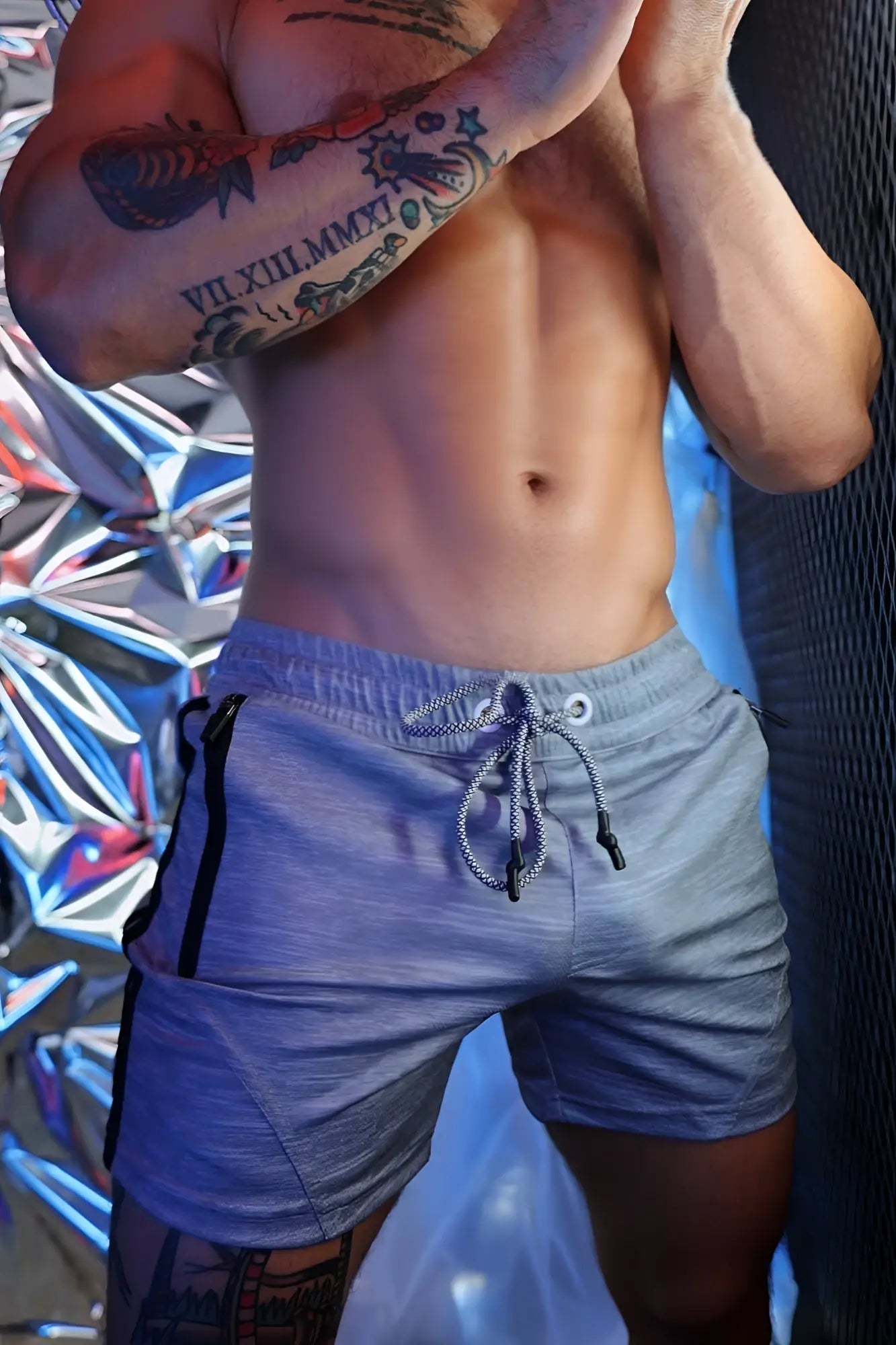 Gray trade trainer shorts with black side stripes and a drawstring waistband for athletic use
