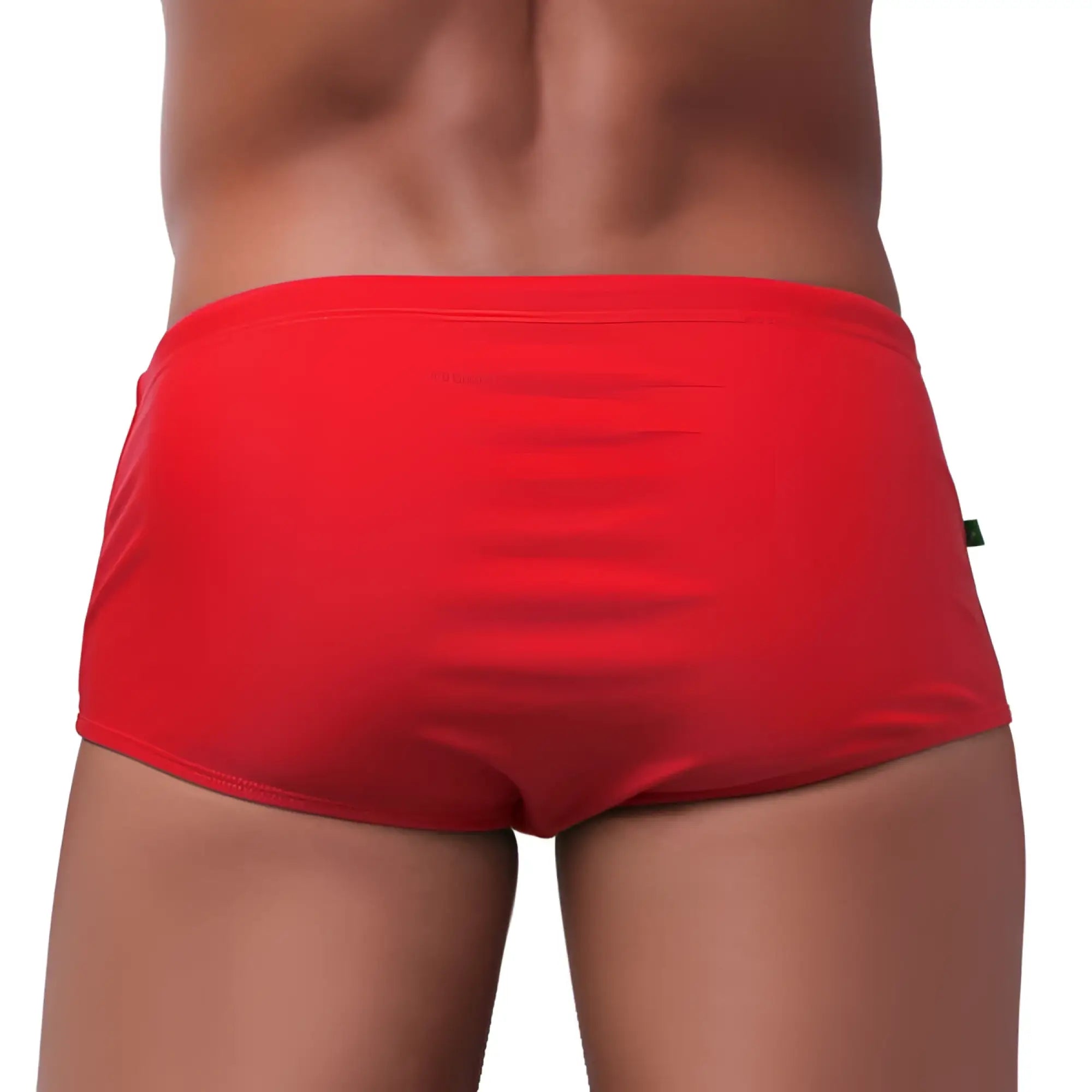 Bright red traditional square solids cut sunga male bathing suit with smooth form-fitting fabric and small green side tag