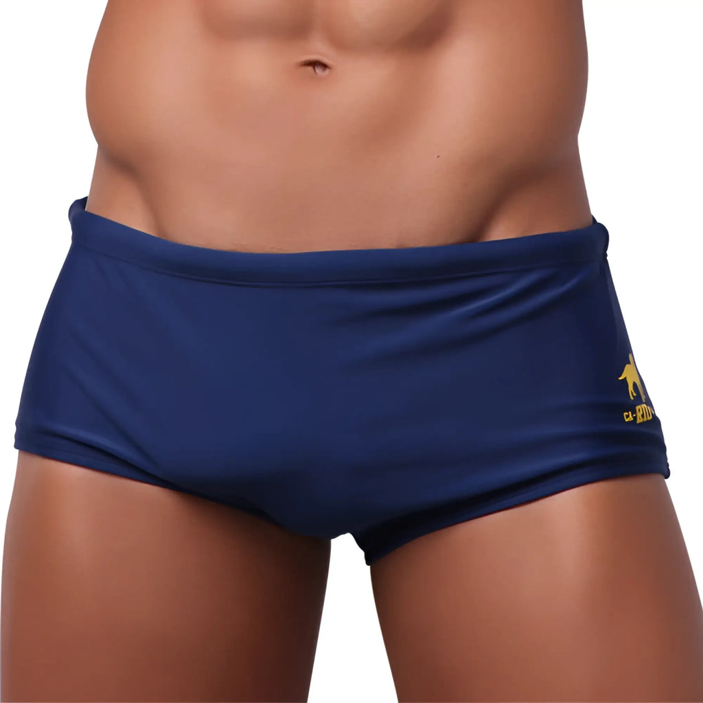Navy blue traditional square solids cut sunga male bathing suit with small yellow logo on the side