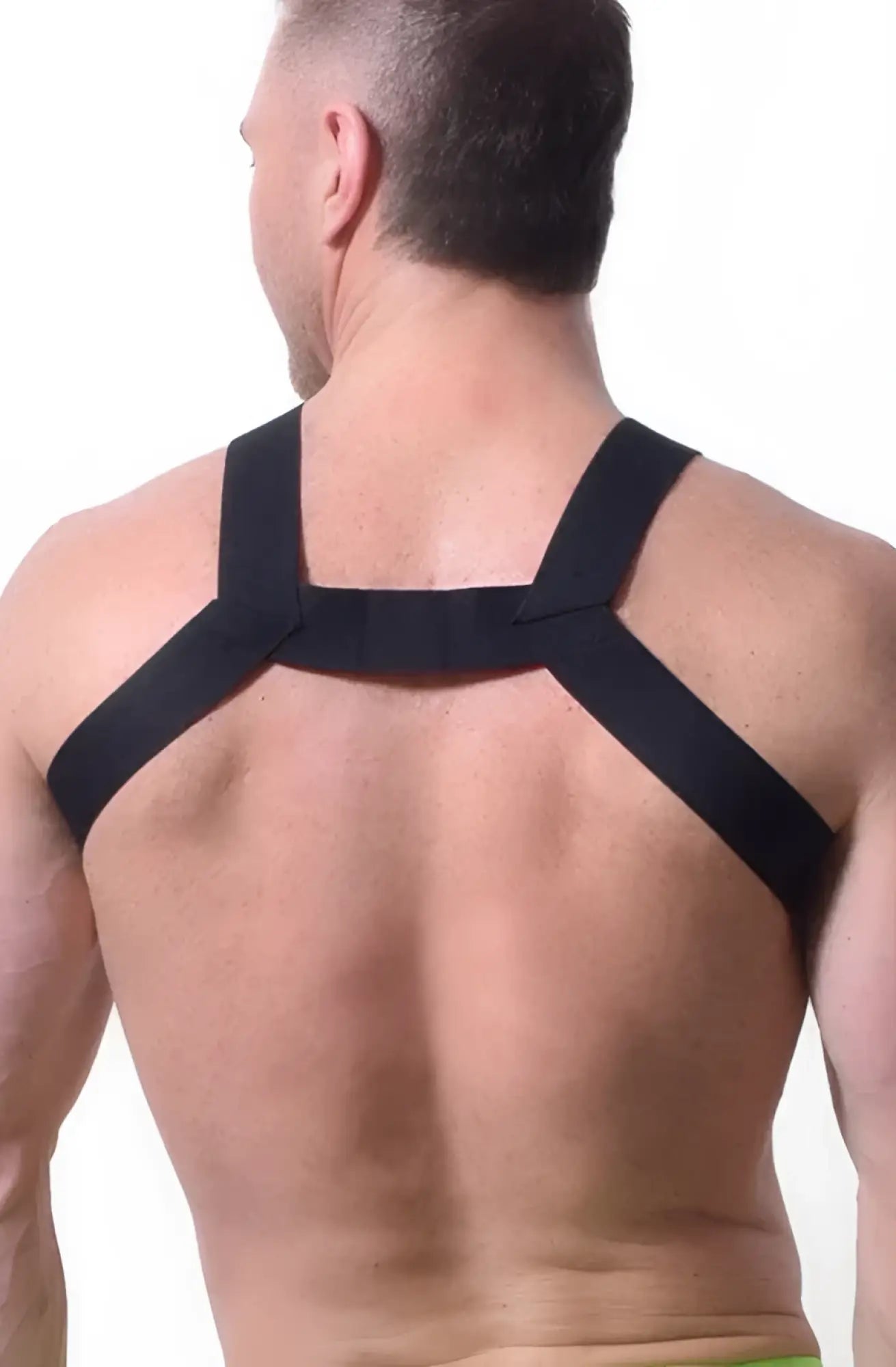 Black elastic strap transistor harness worn across the back showing adjustable support design