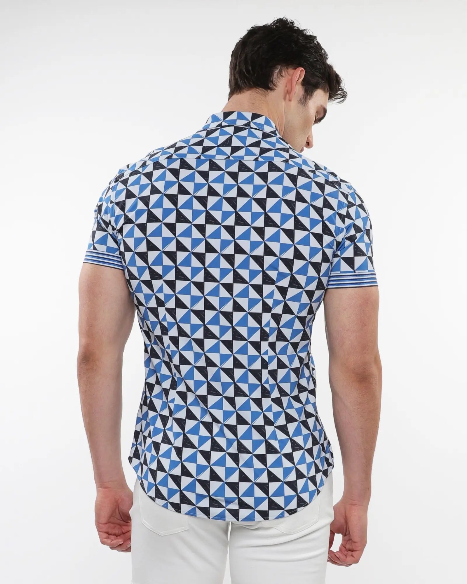 A man wearing a triangles printed performance short-sleeved shirt with blue black and white geometric pattern