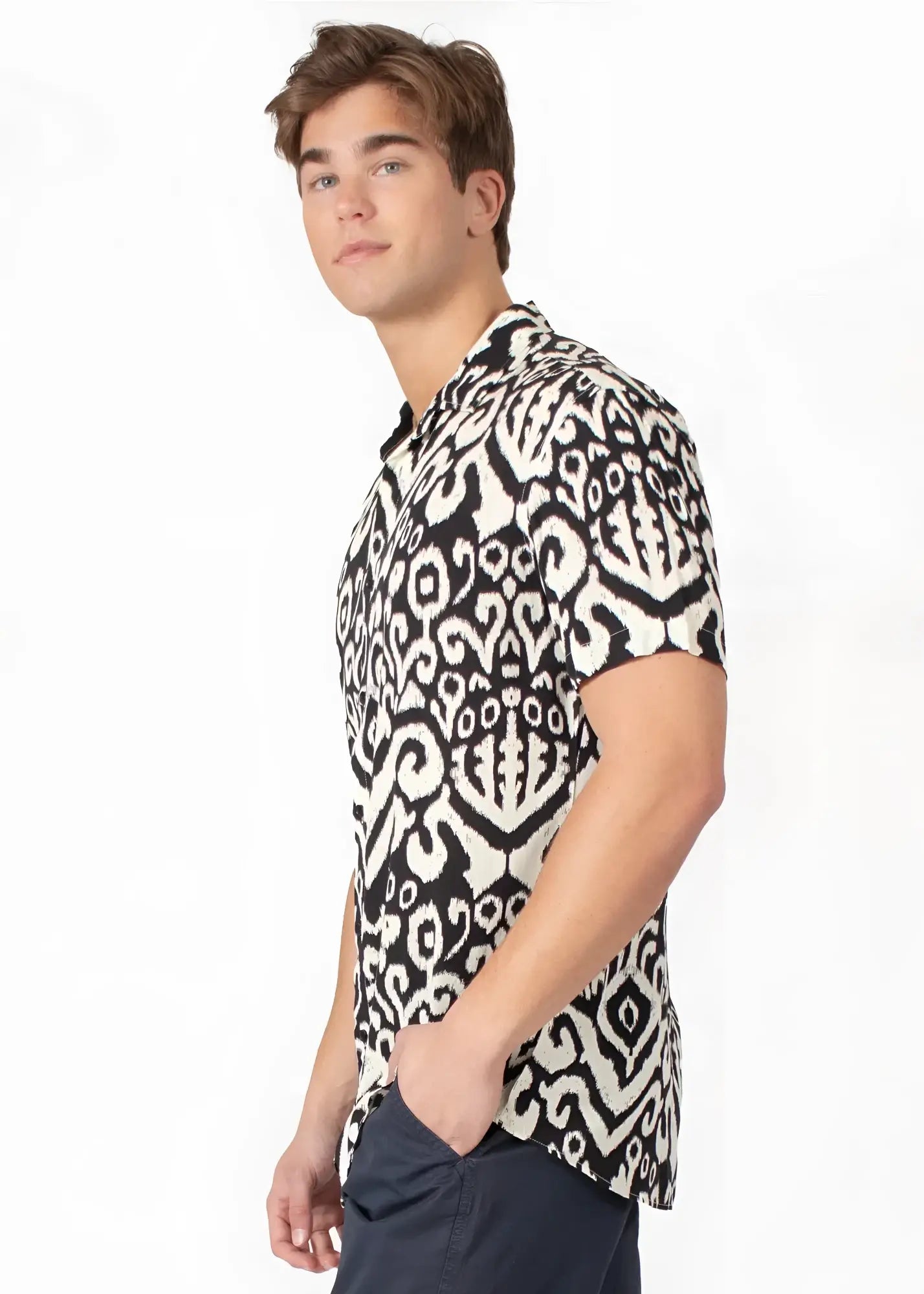 Black and white short-sleeved button-up shirt with intricate ikat tribal abstract pattern for casual wear