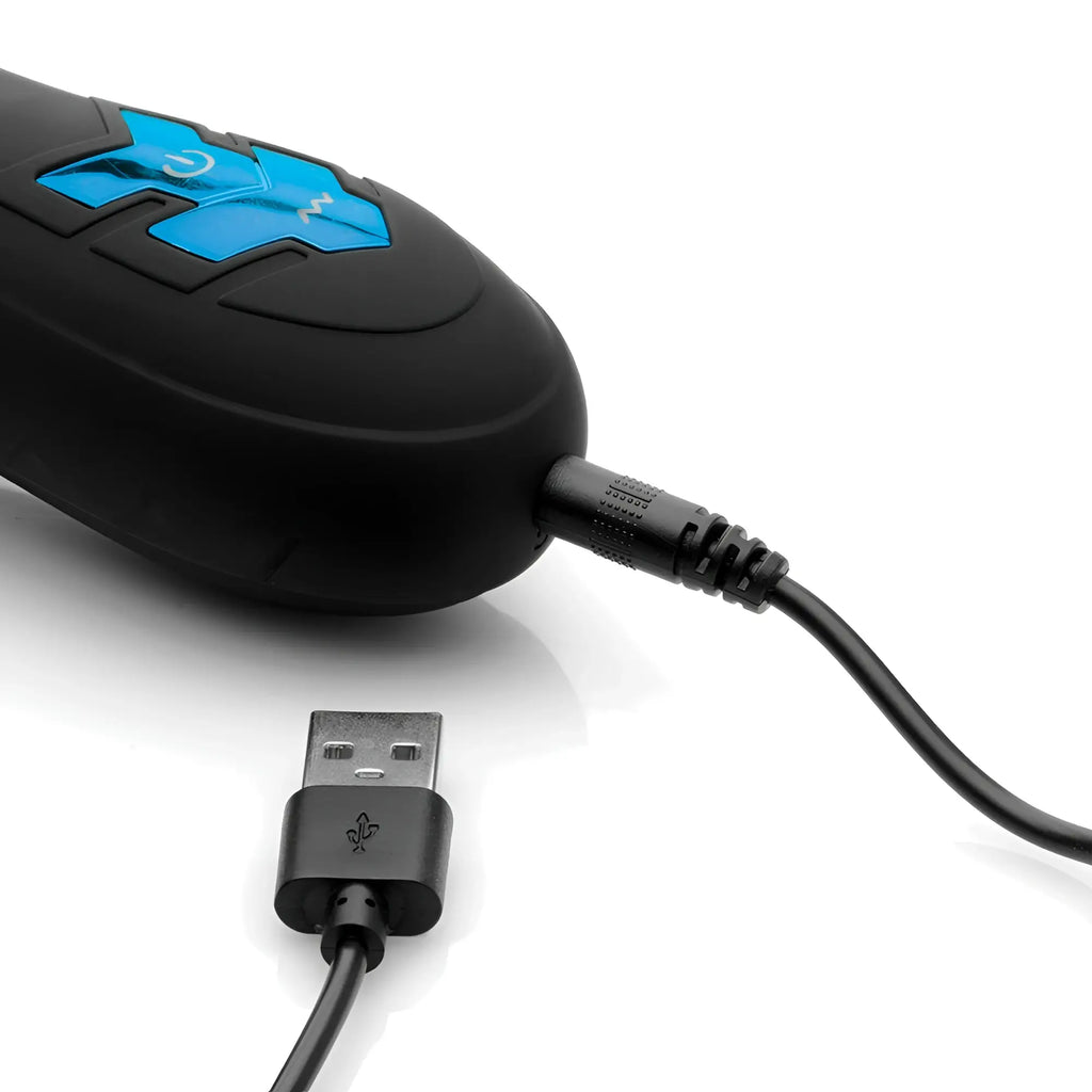 Trinity Men 10X Turbo Silicone Penis Head Pleaser in black with a blue control panel connected to a USB charging cable.