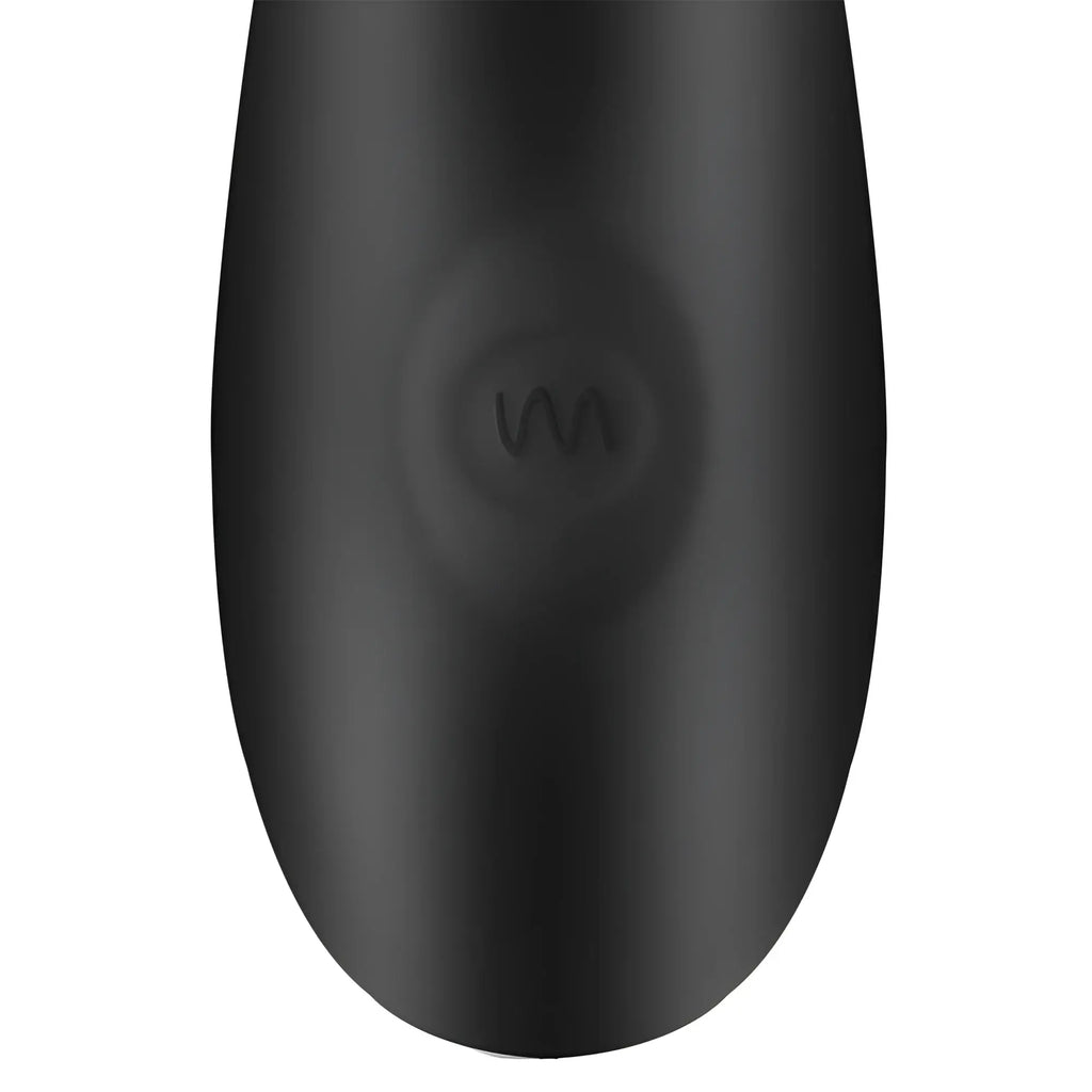 Close-up of the black silicone handle of the Trinity Men 12X prostate vibrator, featuring a raised wave-pattern button.
