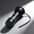 Trinity Men 16X: Matte black handheld teaser with a contoured base, power button, and a thin, flexible urethral sound.