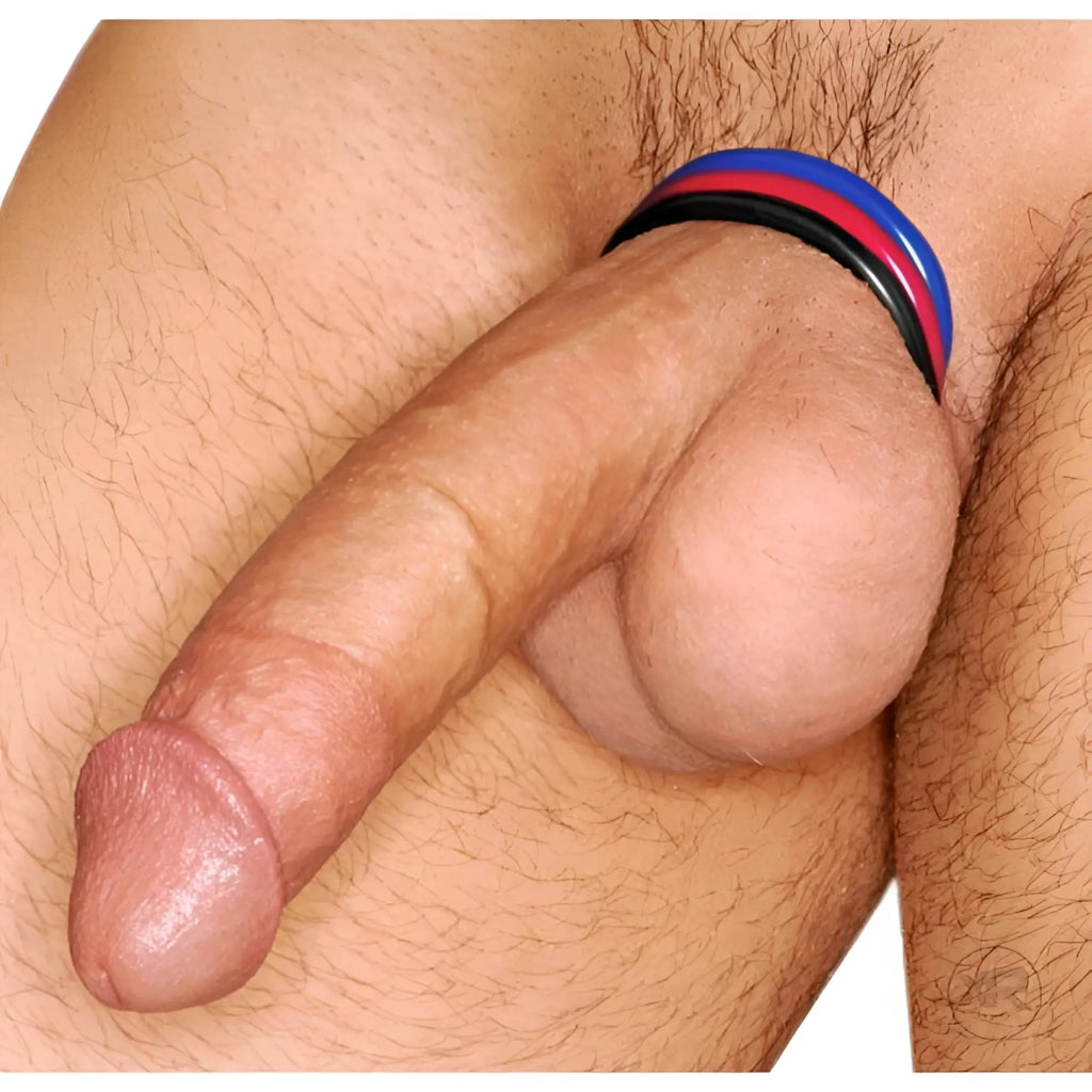 Trinity Men 3pk Stretchy Cock Ring Set featuring three slim, colorful silicone rings worn at the base of the penis.
