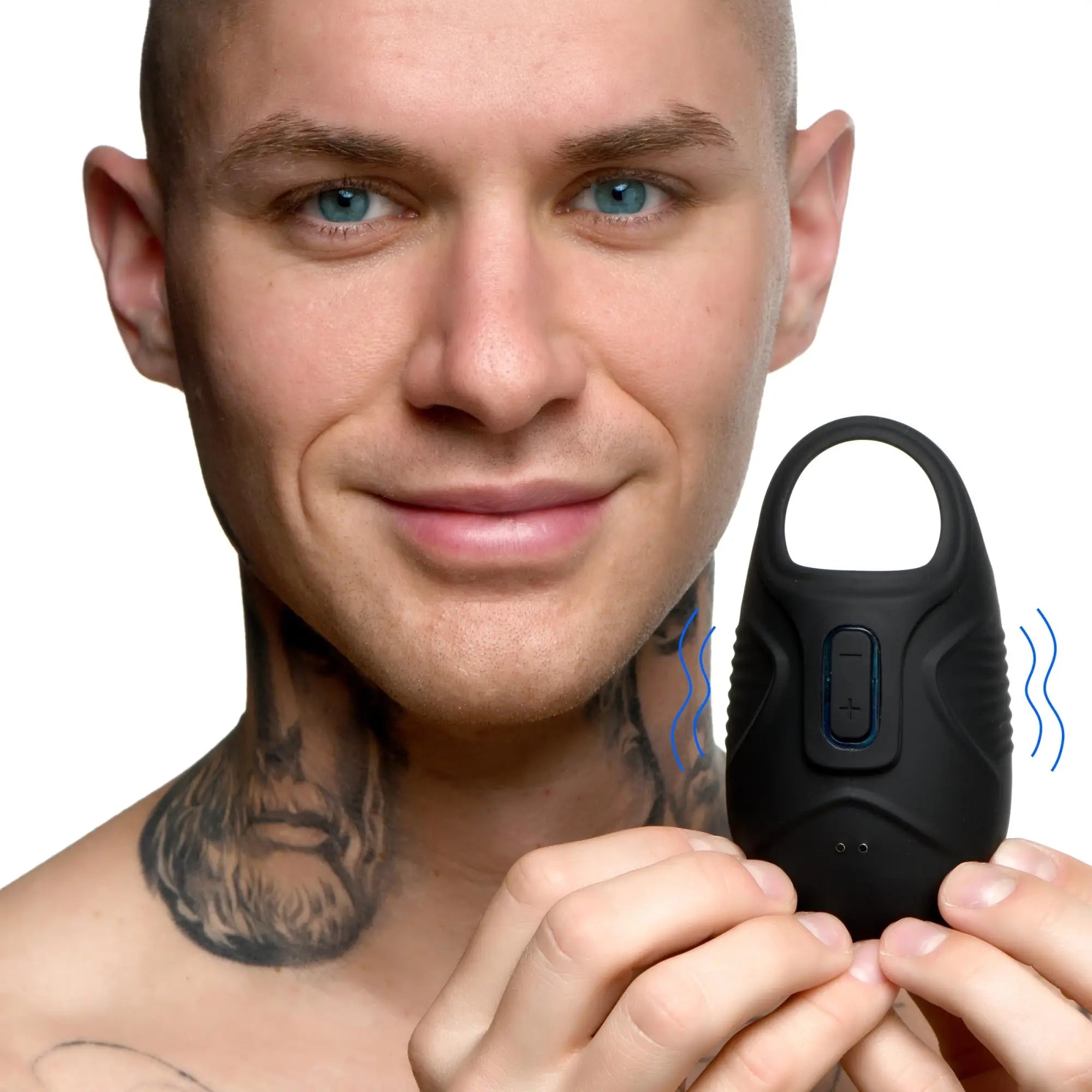 Man holding a black, silicone Trinity Men 7x vibrating testicle massager with blue vibration icon lines.