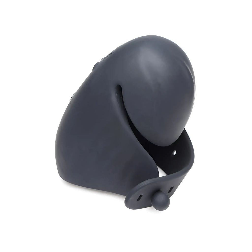 Trinity Men 8X: A smooth, dark grey, curved silicone penis head stimulator with an adjustable strap closure.