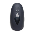 Trinity Men 8X: A smooth, charcoal-gray, oval silicone stimulator with a central diamond-shaped control button.