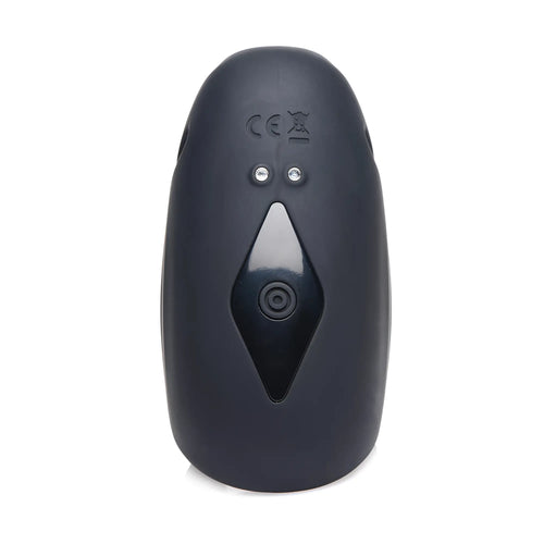 Trinity Men 8X: A smooth, charcoal-gray, oval silicone stimulator with a central diamond-shaped control button.