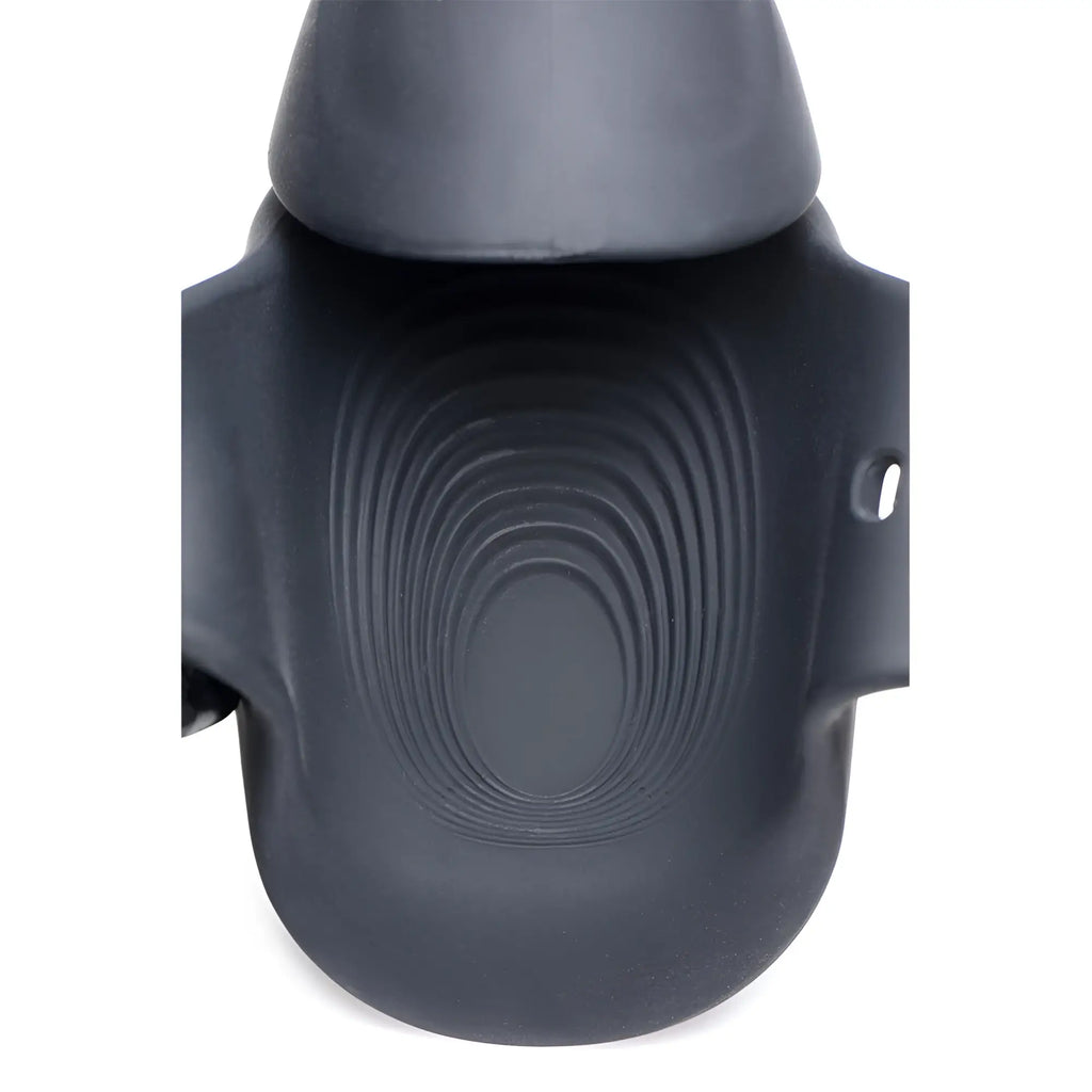 Trinity Men 8X Vibrating Silicone Stimulator in matte black, featuring a textured, ribbed oval interior design.