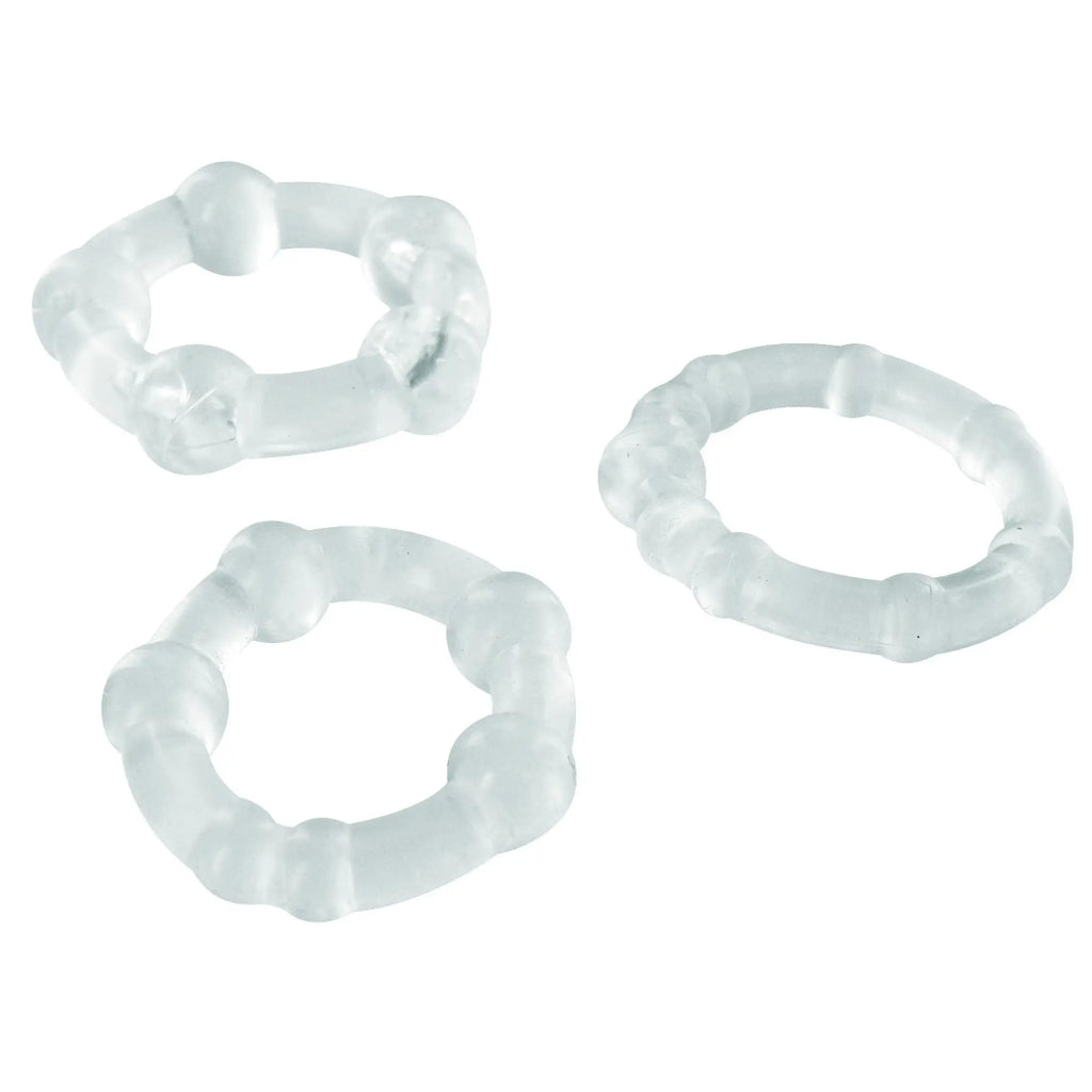 Three Trinity Men Clear Performance cock rings in clear, textured silicone, displayed on a white background.