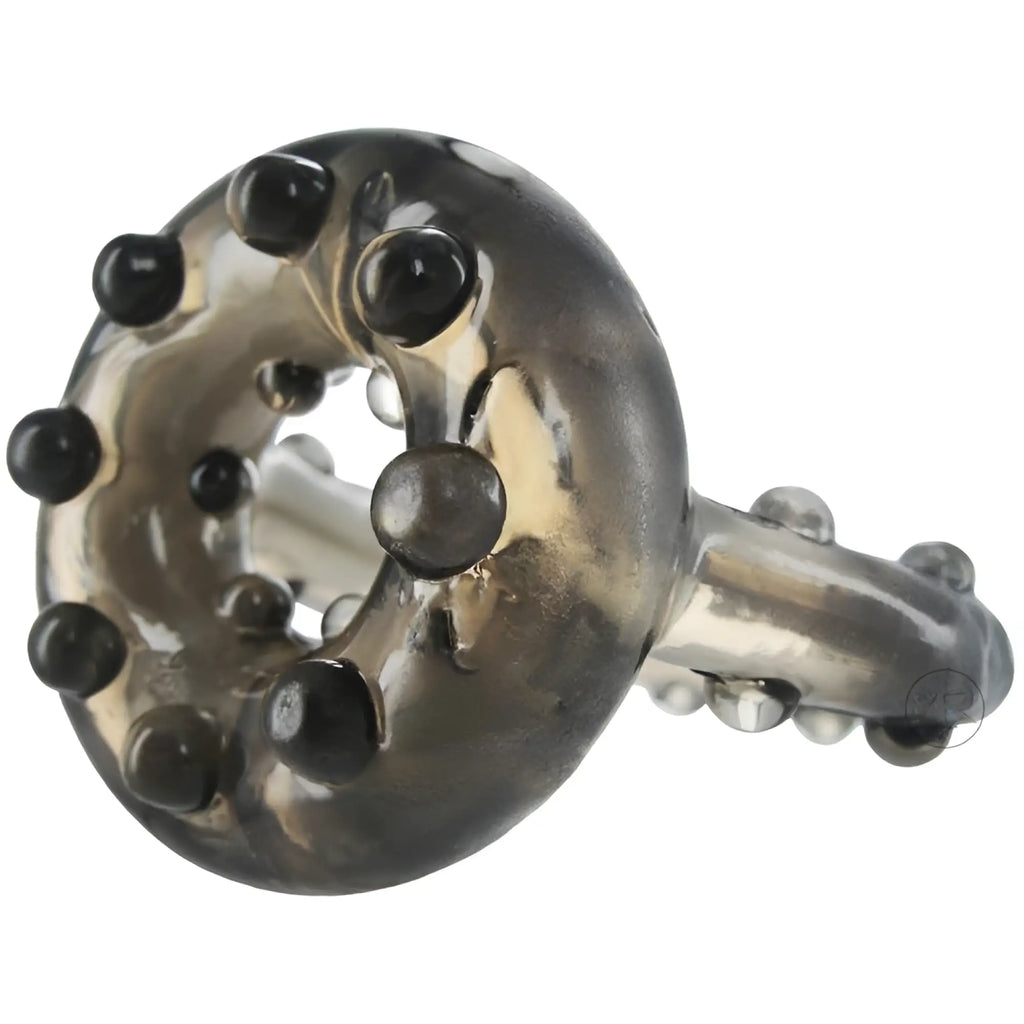 Trinity Men The Enhancer cock ring: a translucent, smoke-colored silicone ring featuring raised beaded texture.