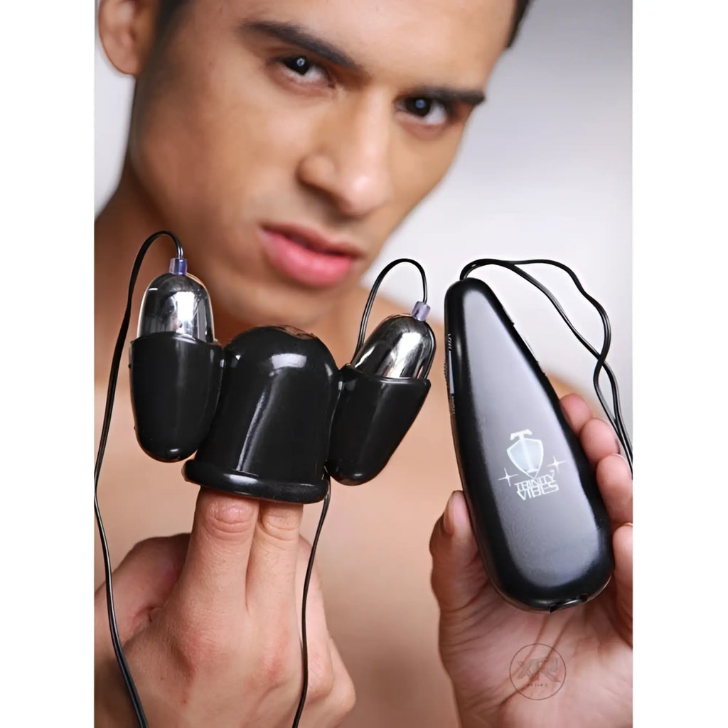 Trinity Men Multi Speed Vibrating Penis Head Teaser: Black, triple-pronged massager with silver tips and a remote.