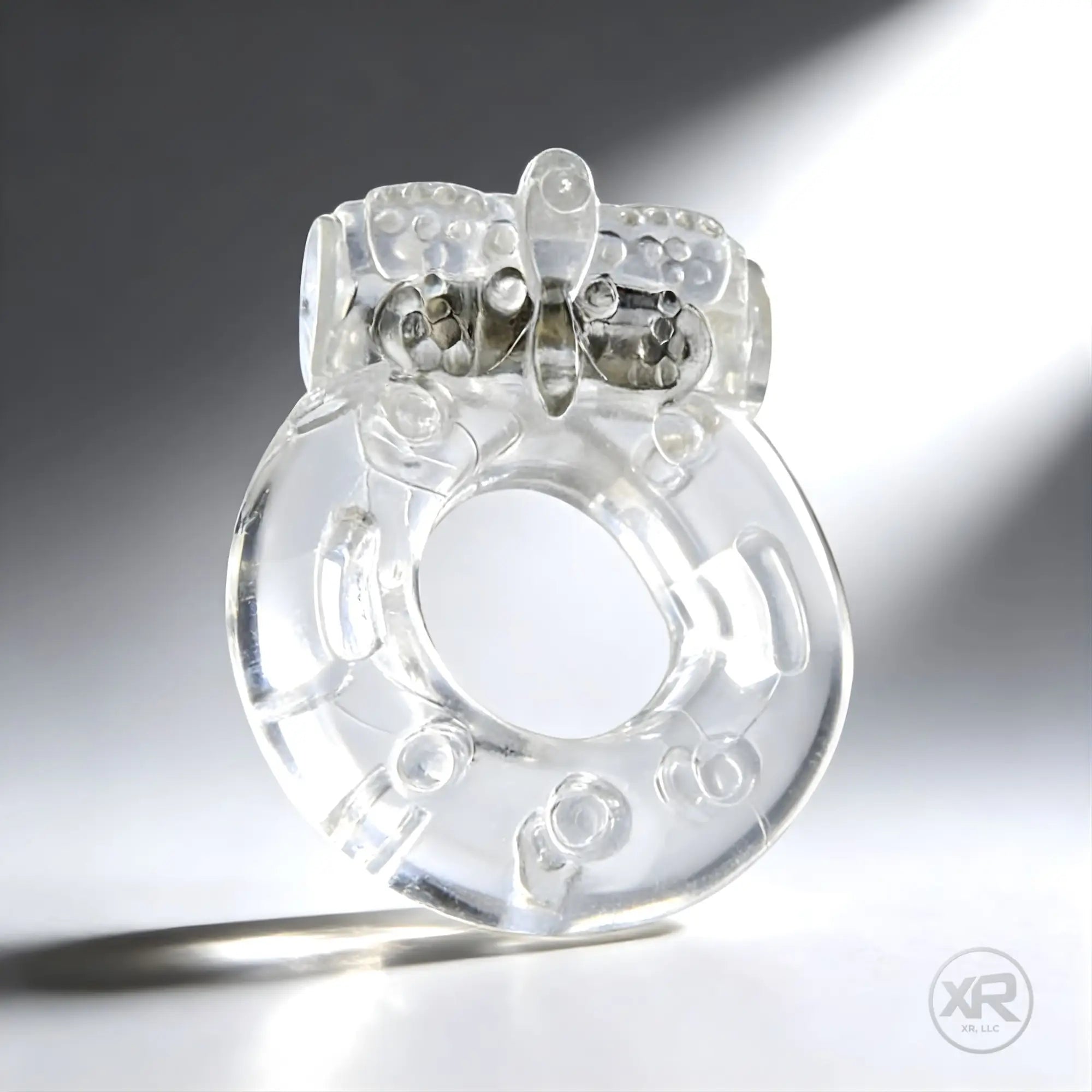 Trinity Men Platinum Orgasmic vibrating cock ring: a clear, textured, ring-style silicone enhancer with a top stimulator.