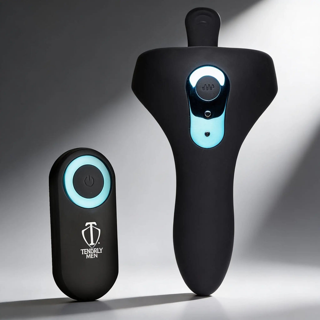 Black Trinity Men Power Taint 7X silicone cock and ball ring with a matching remote featuring blue LED accents.