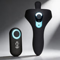 Black Trinity Men Power Taint 7X silicone cock and ball ring with a matching remote featuring blue LED accents.