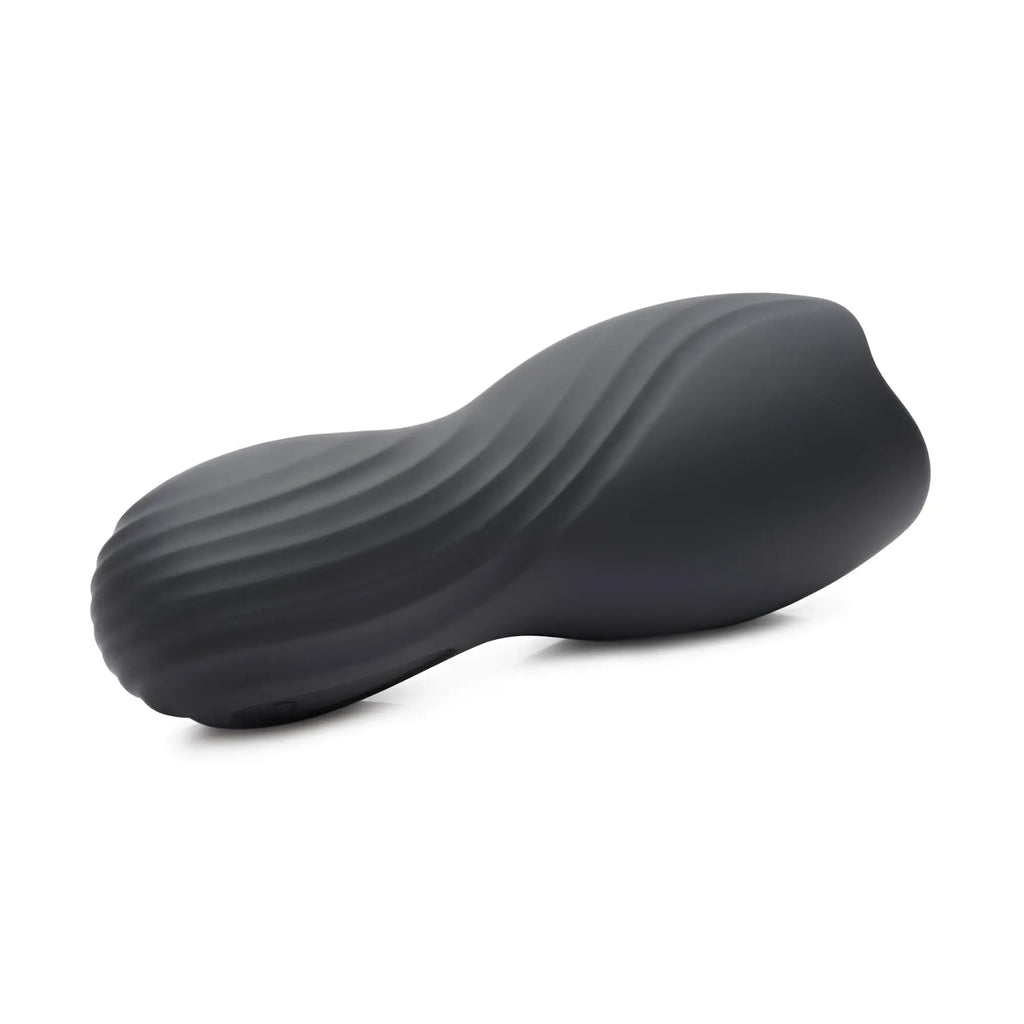 Trinity Men Vibrating Penis Pleaser: A contoured, matte black, ergonomic masturbator with a textured, wavy surface.