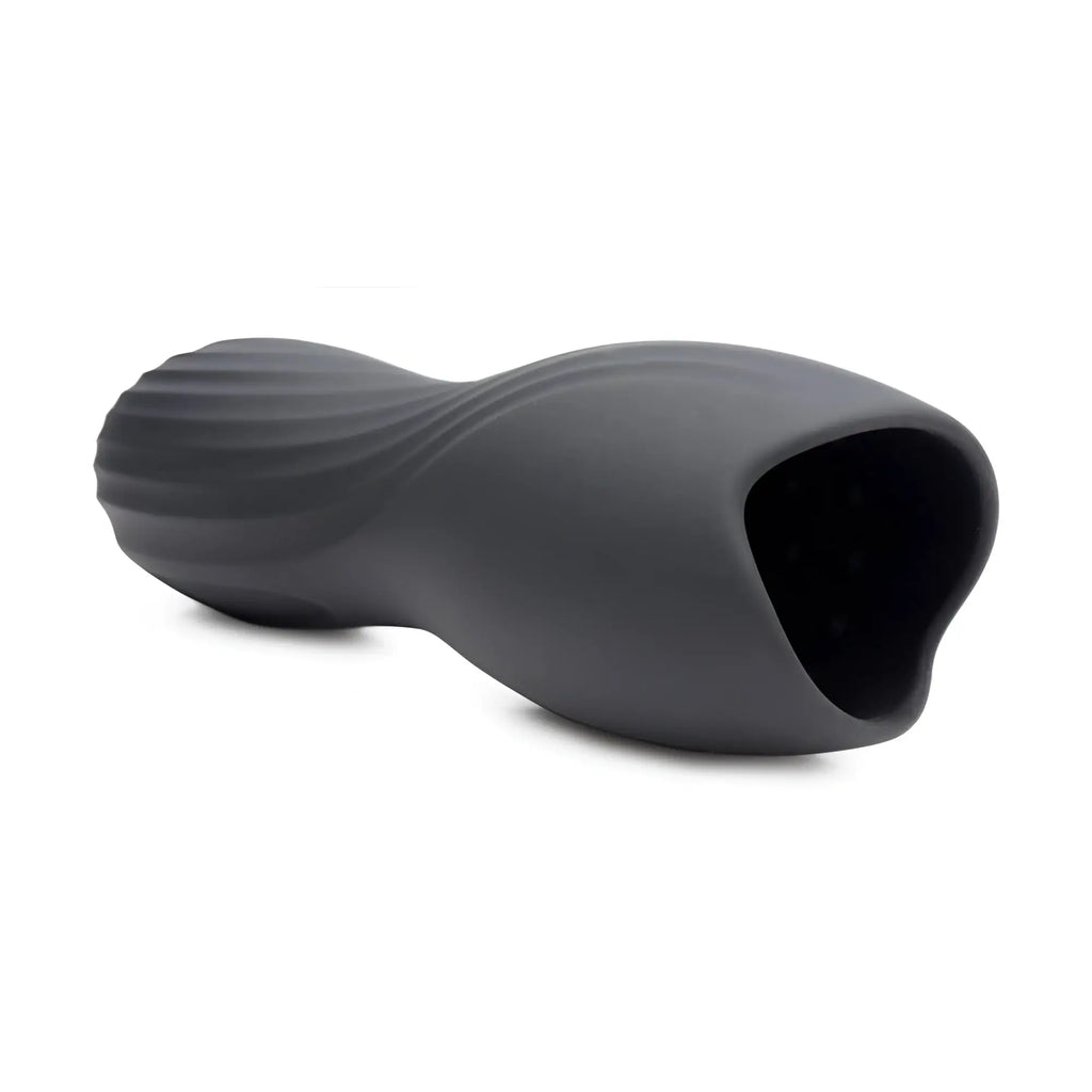 Trinity Men Vibrating Penis Pleaser: a matte black, hourglass-shaped masturbator with a ribbed, textured exterior.