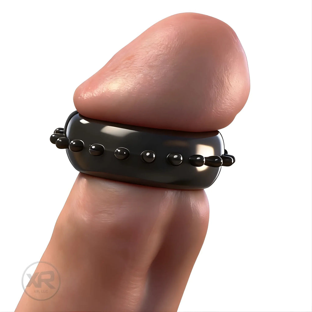 Trinity Vibes Gummy Cock Ring: a black, studded silicone ring worn around the base of a penis.