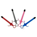 Trinity Vibes Lubricant Launchers: Four syringe-style applicators in red, grey, pink, and blue against a white background.