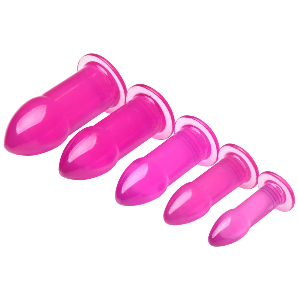 Trinity Vibes 5pc purple anal trainer kit: Five smooth, graduated-size plug toys in a vibrant translucent purple.