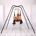 Trinity Vibes Trinity Sex Swing Stand featuring a black metal frame and an adjustable harness seat for suspension.