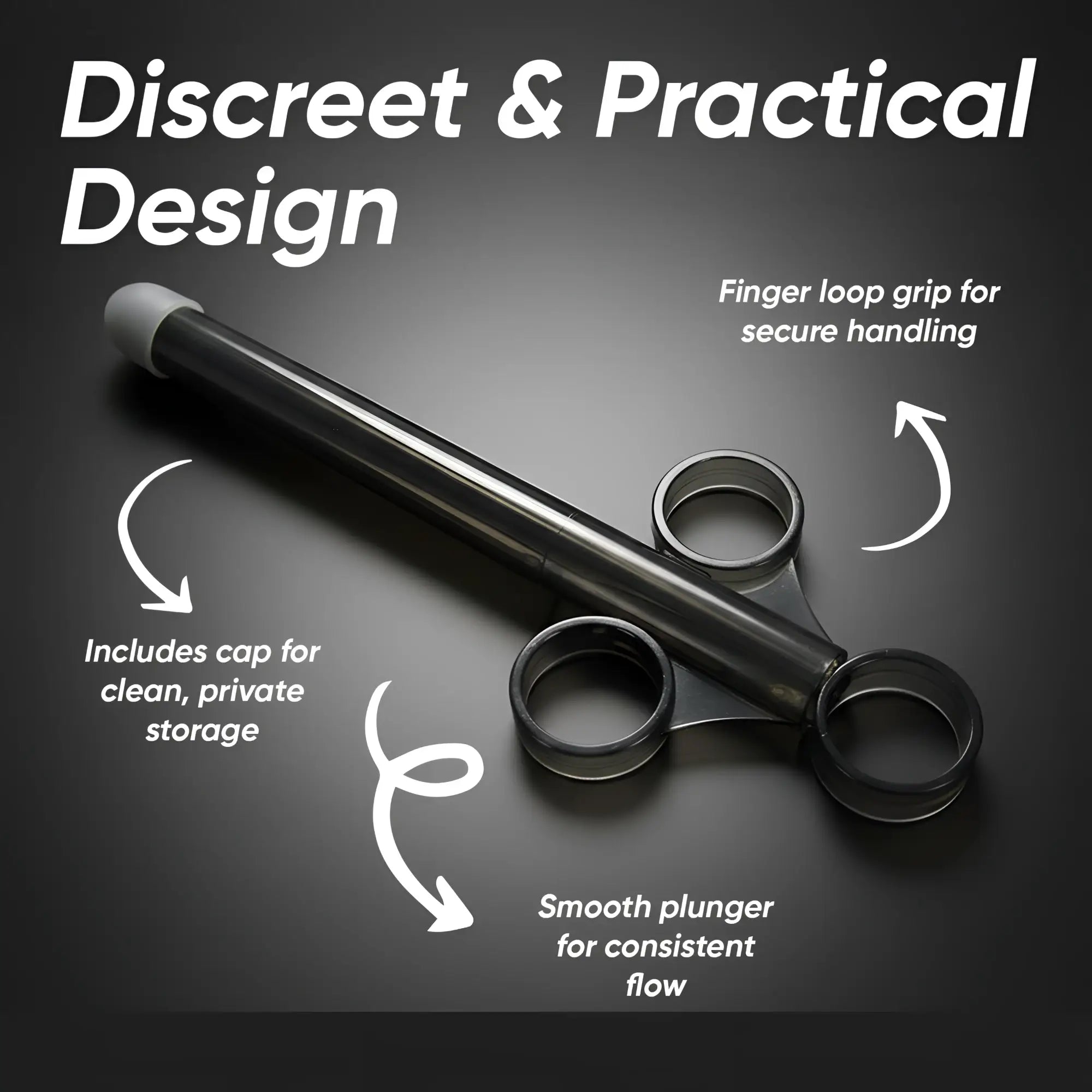 Black Trinity Vibes XL lubricant launcher with a finger-loop grip, plunger, and storage cap against a dark background.