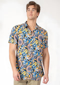 A vibrant blue and yellow floral-patterned tropical abstract short-sleeve button-up shirt with classic collar