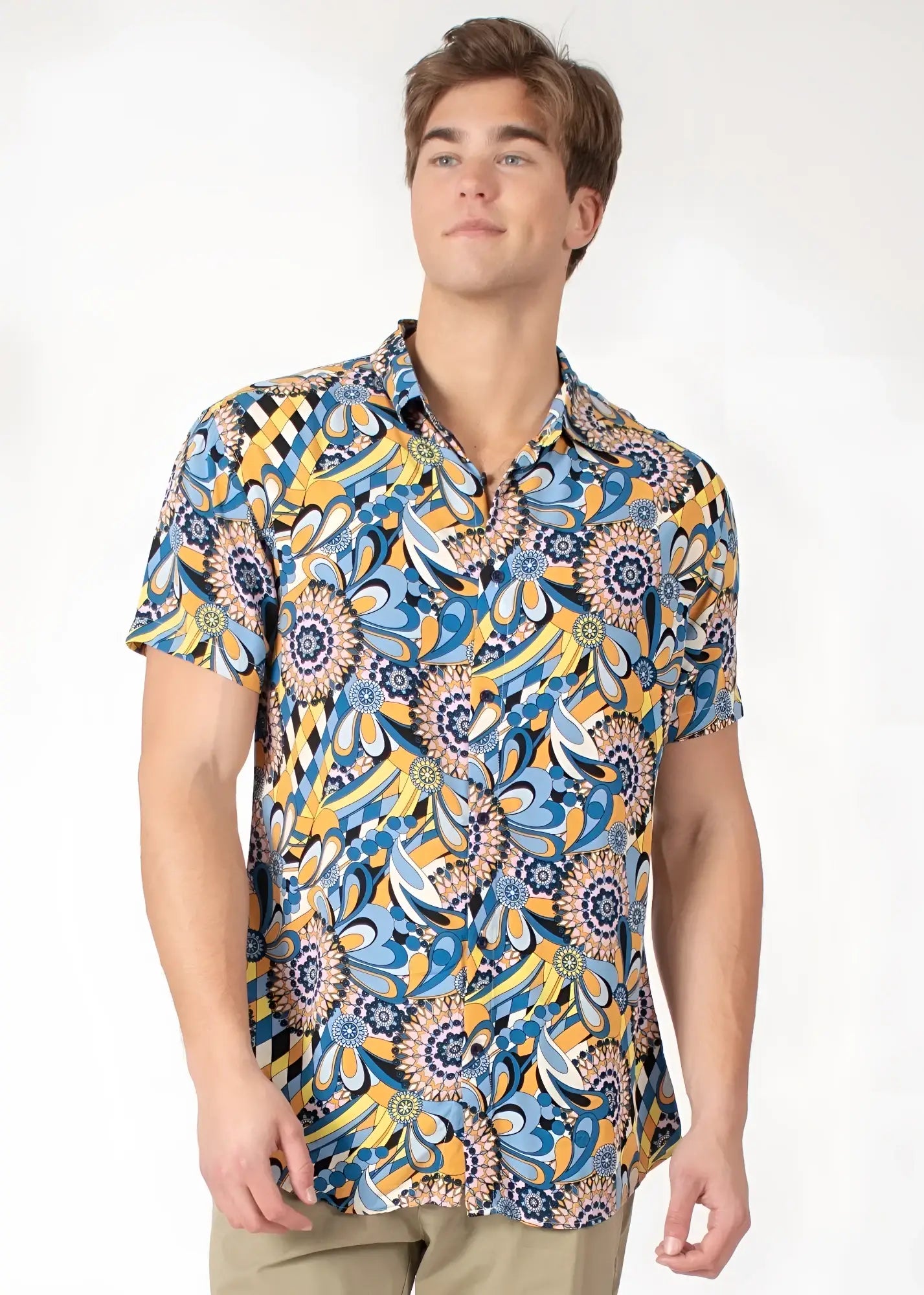 A vibrant blue and yellow floral-patterned tropical abstract short-sleeve button-up shirt with classic collar