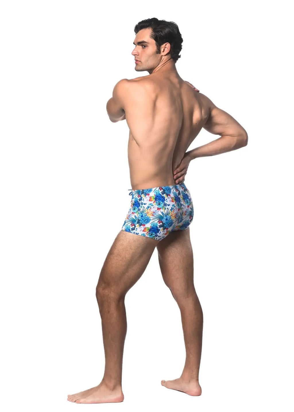 Blue floral-patterned tropics printed swim trunks made of lightweight fabric for beach and pool use