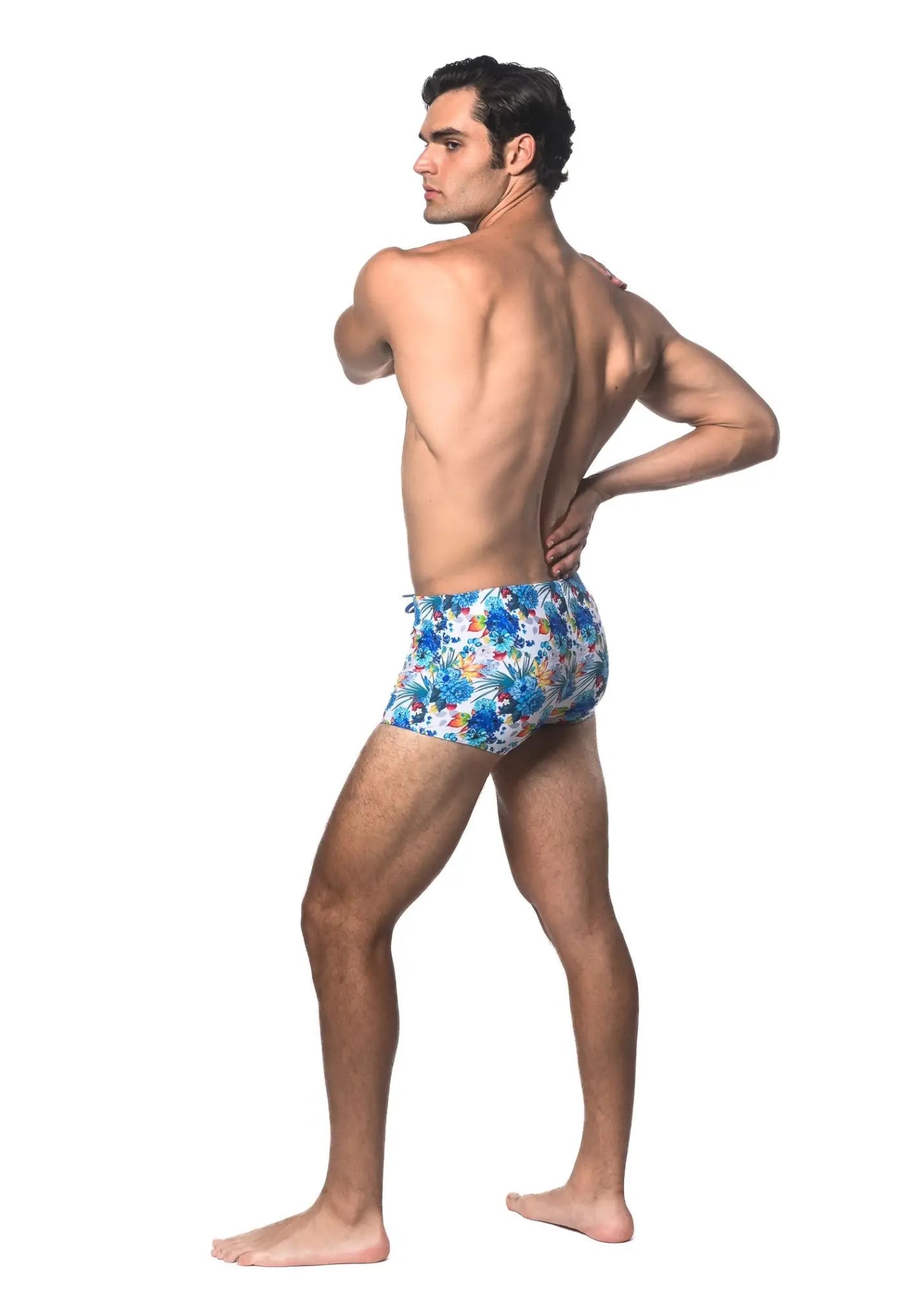 Blue floral-patterned tropics printed swim trunks made of lightweight fabric for beach and pool use