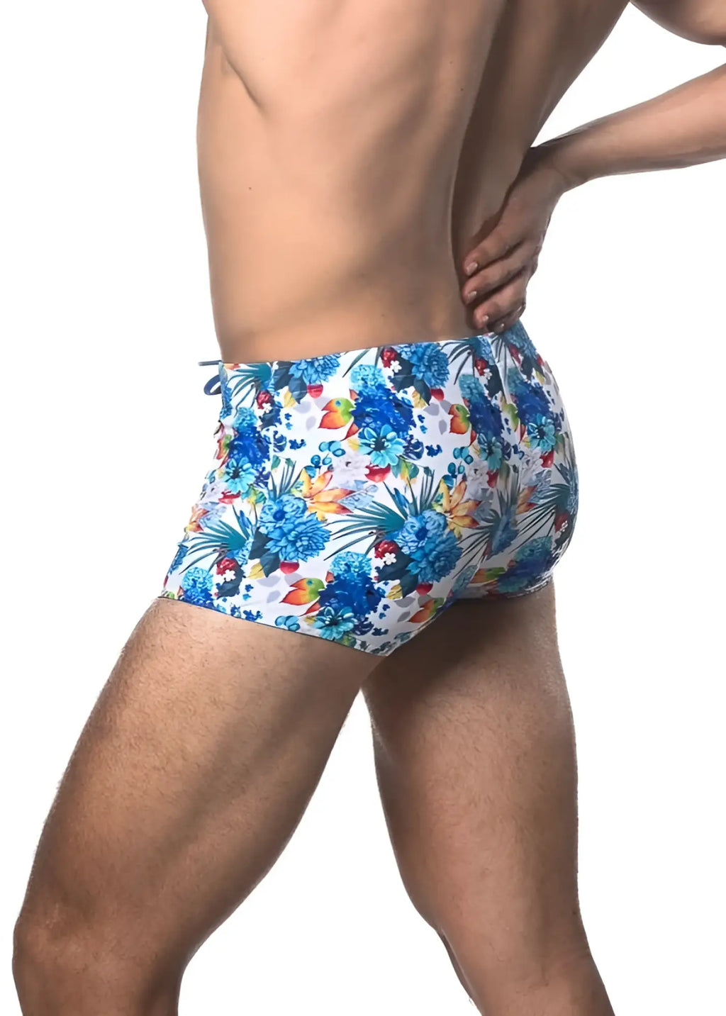 Tropics printed swim trunk with blue and multicolored tropical floral pattern perfect for beach and poolwear